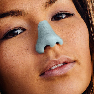 Blue Noz on a woman's nose 